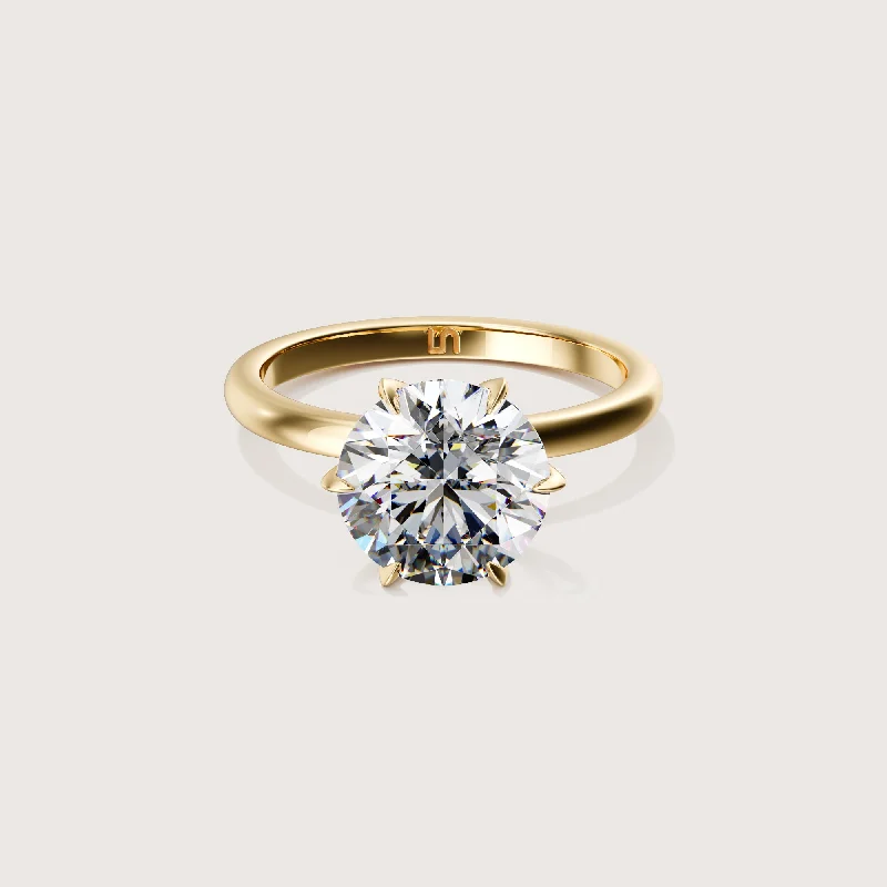 Pear - shaped diamond engagement ring with side baguette diamonds in 18K goldIcon Round Solitaire - 6 claw