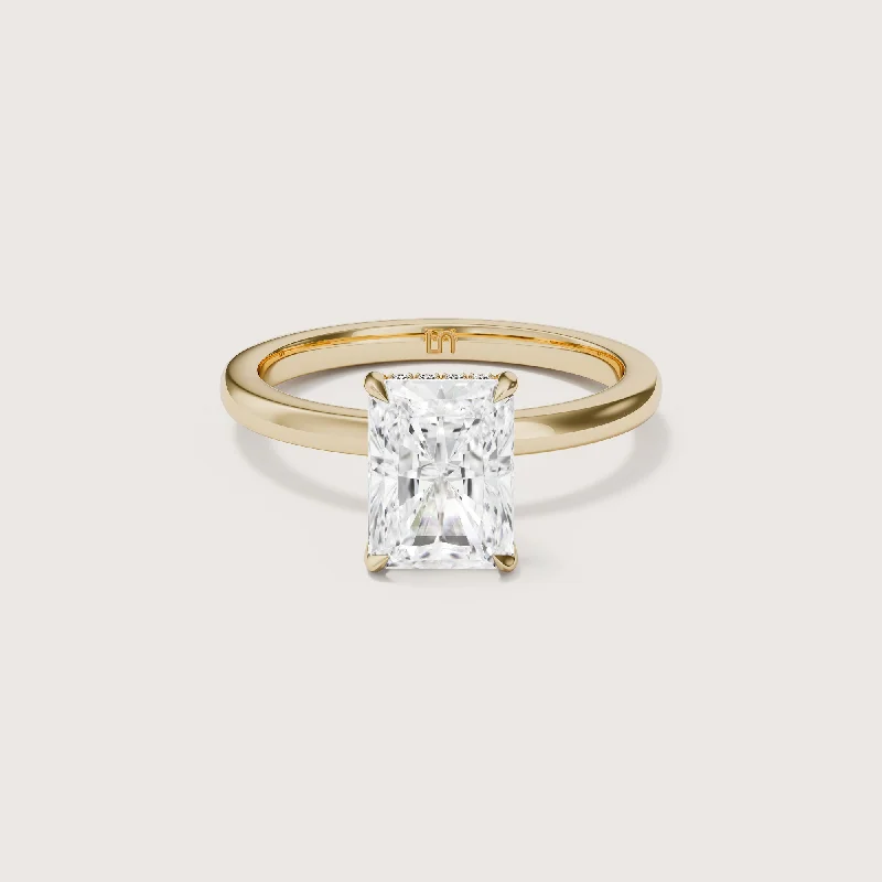 Princess - cut diamond engagement ring with a pavé - set band in platinumBianca Radiant Solitaire - Hidden Halo