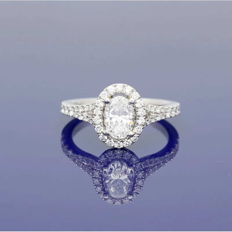 Three - Stone Women's Diamond Rings Symbolizing Past, Present, and Future with Emerald - Cut DiamondsPlatinum Certificated Oval Cut Diamond Halo Ring with Diamond Set Shoulders