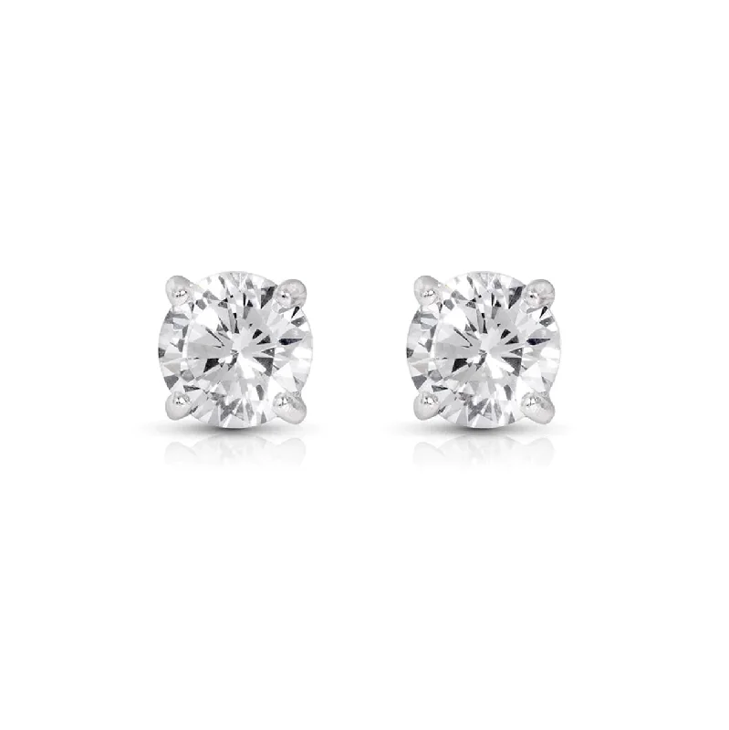 Cushion - cut diamond engagement ring with a halo of moissanite in a silver - plated bandClassic 4-Prong Diamond Stud Earrings - 1.50 twt.