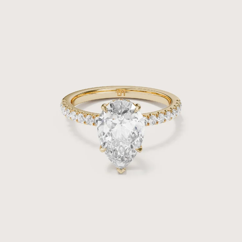 Round - cut diamond engagement ring with a twisted band design in 14K white goldVera Pear Solitaire - Hidden Halo Diamond Band