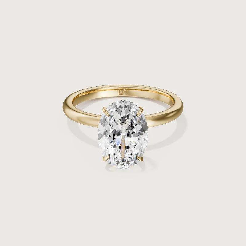 Round - cut diamond engagement ring with a twisted band design in 14K white goldIcon Oval Solitaire - 4 claw