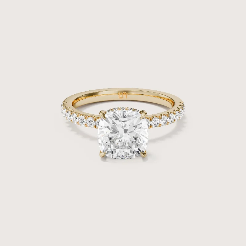 Cushion - cut diamond engagement ring with a halo of moissanite in a silver - plated bandVera Cushion Solitaire - Hidden Halo Diamond Band