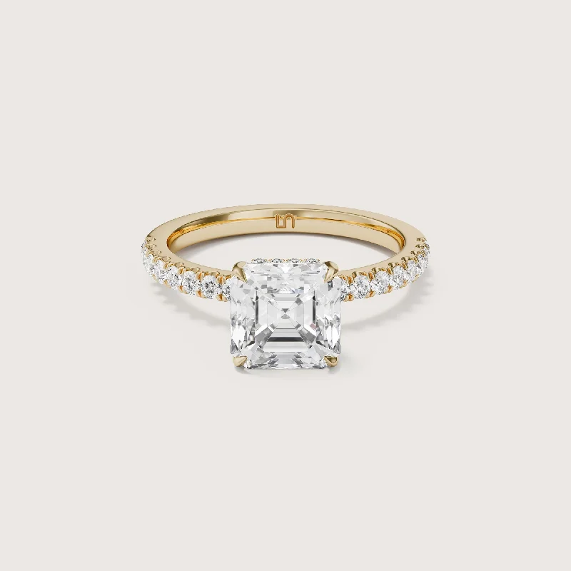 Three - stone diamond engagement ring in rose gold, symbolizing past, present, and futureVera Asscher Solitaire - Hidden Halo Diamond Band