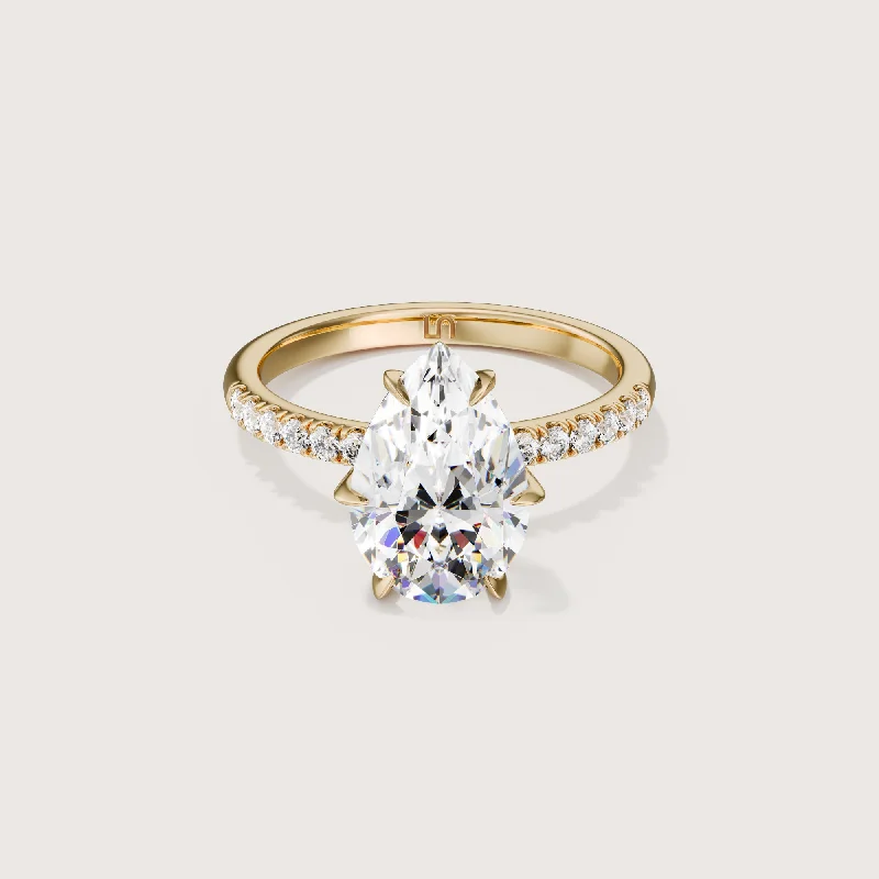 Heart - shaped diamond engagement ring with a hidden halo in 14K rose goldIcon Pear Solitaire - 6 Claw - Diamond Band