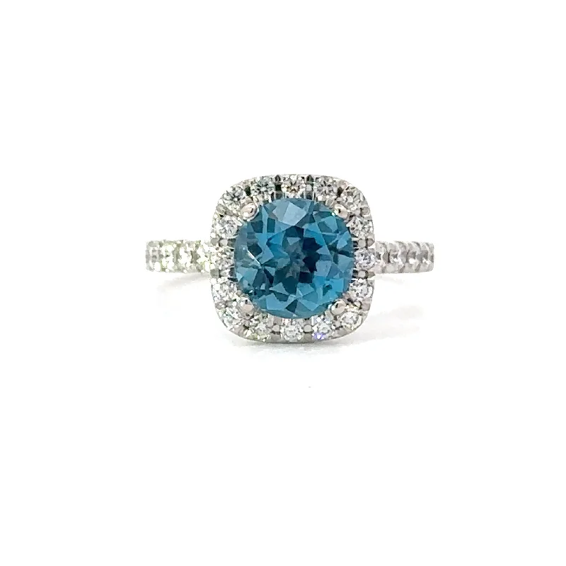 Cathedral - Style Women's Diamond Rings with a Raised Center Setting and Elaborate MetalworkLondon Blue Topaz Ring with Cushion Diamond Halo