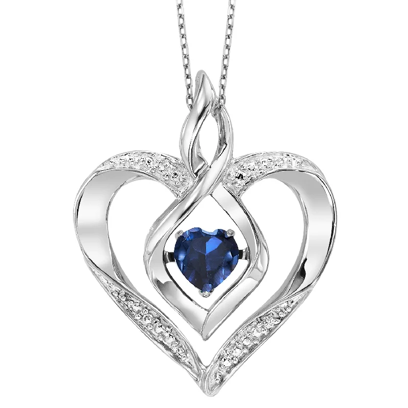 Pear - shaped diamond engagement ring with side baguette diamonds in 18K goldCreated Sapphire Heart Necklace by Rhythm of Love