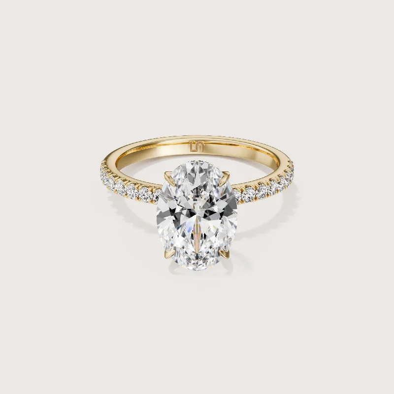 Three - stone diamond engagement ring in rose gold, symbolizing past, present, and futureIcon Oval Solitaire - 4 claw - Diamond Band