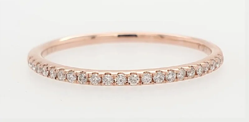 Halo diamond engagement ring in 18K white gold with a center oval - cut stoneClassic Pave Diamond Band in Pink Gold- 0.11 ctw.