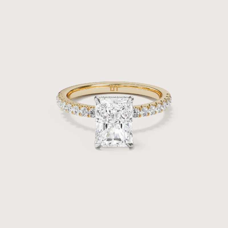 Three - stone diamond engagement ring in rose gold, symbolizing past, present, and futureVera Radiant Solitaire - Hidden Halo Diamond Band