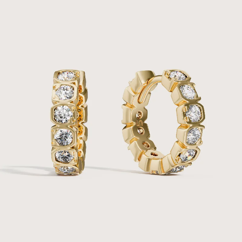 Round - cut diamond engagement ring with a twisted band design in 14K white goldCielo Earrings