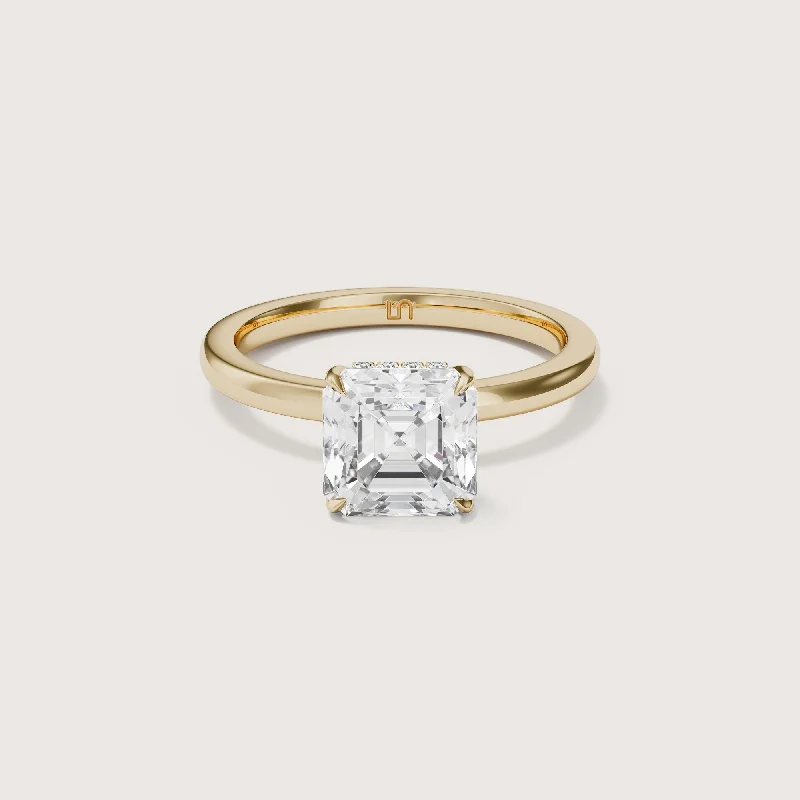 Cushion - cut diamond engagement ring with a halo of moissanite in a silver - plated bandBianca Asscher Solitaire - Hidden Halo