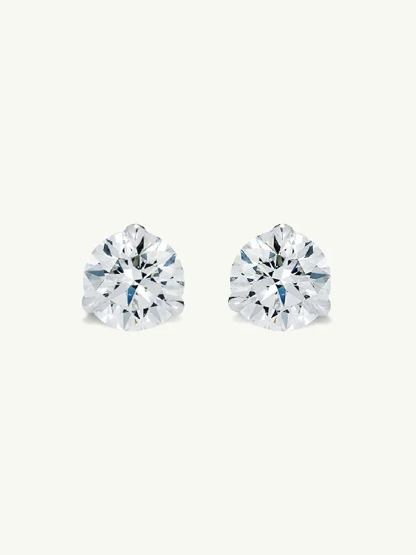 Oval - cut sapphire and diamond engagement ring in 18K white goldSolitaire White Diamond Stud Earrings in 3-Prong Settings, 2.00 Carats