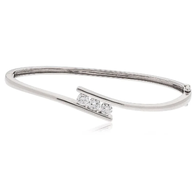 Unisex Bangle Bracelets with Abstract Artwork for a Unique StatementDIAMOND THREE-STONE CROSS OVER BANGLE IN 18K WHITE GOLD