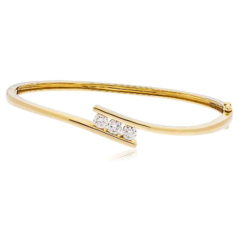 Bangle Sets with Mix - and - Match Patterns for a Versatile AccessoryDIAMOND THREE STONE CROSS OVER BANGLE IN 9K YELLOW GOLD