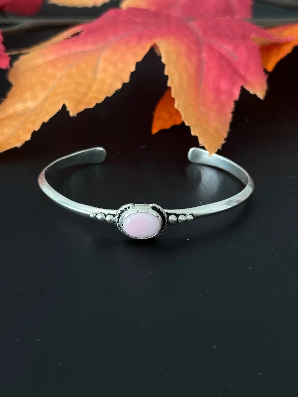 Silk - Wrapped Women's Cuff Bracelets in Soft Pastels for a Delicate and Elegant AppearanceNavajo Made Pink Conch & Sterling Silver Cuff Bracelet