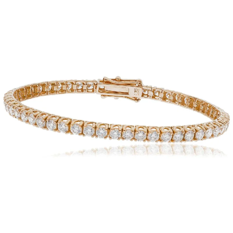 Solid Gold Bangles with Intricate Floral Engravings for a Luxurious LookRound Cut Diamond Line Tennis Bracelet 4 Crossover Claw setting