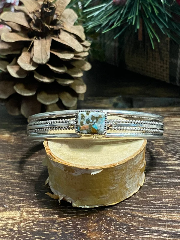 Women's Stainless Steel Cuff Bracelets with Geometric Designs for a Modern and Minimalist StyleNavajo Made Mohave Turquoise & Sterling Silver Cuff Bracelet