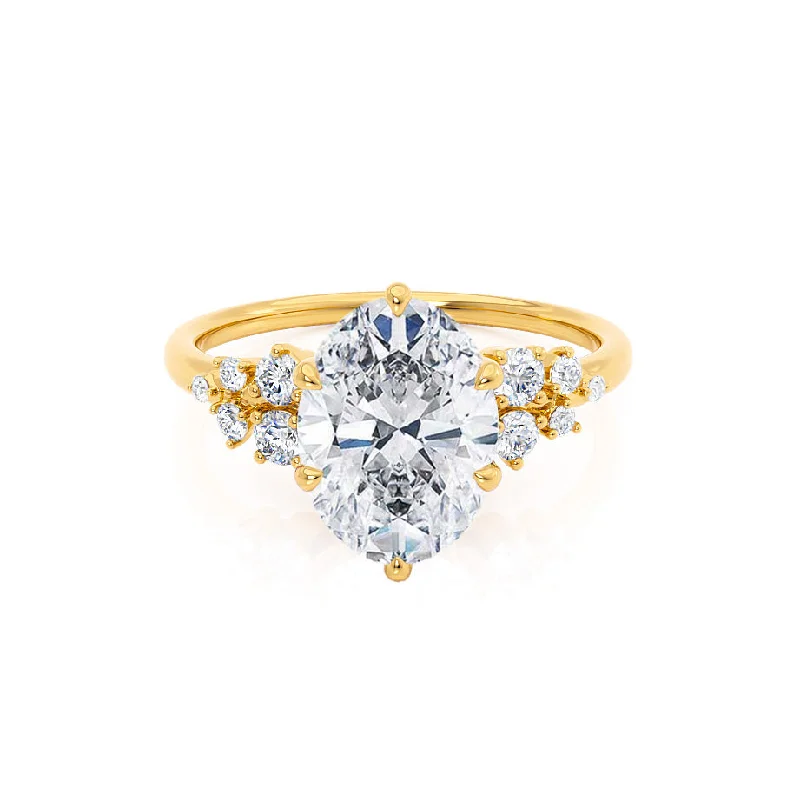 Classic Round Cut Engagement Rings with Platinum Prongs and Halo Setting for Timeless EleganceALYA - Oval Moissanite Starburst Cluster Shoulder Set Engagement Ring 18k Yellow Gold