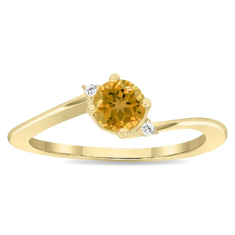 Alexandrite Gemstone Rings in Platinum with a Hidden Halo for a Rare and Luxurious PieceWomen's Round Shaped Citrine and Diamond Wave Ring in 10K Yellow Gold